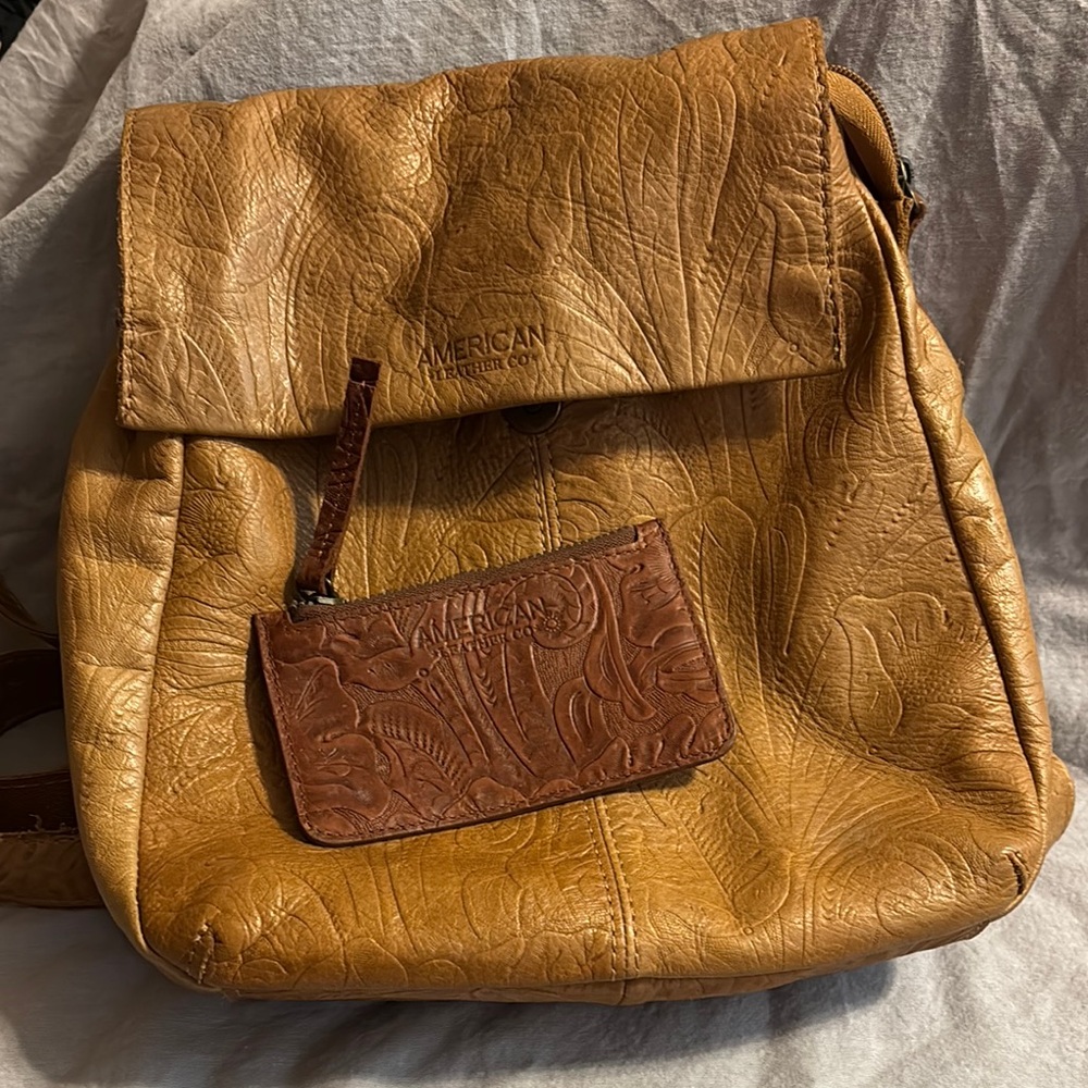 American Leather Company  tooled Backpack purse and coin/card pouch.